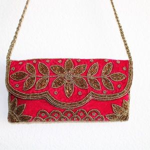 Red zardosi handwork handbag. Can also be used as a clutch